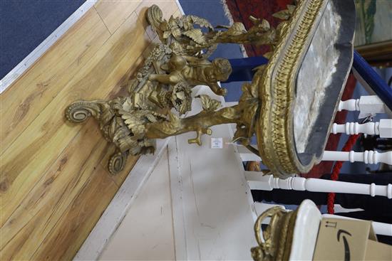 A Victorian carved giltwood and gesso jardinière table, child and trees underframe, W.83cm